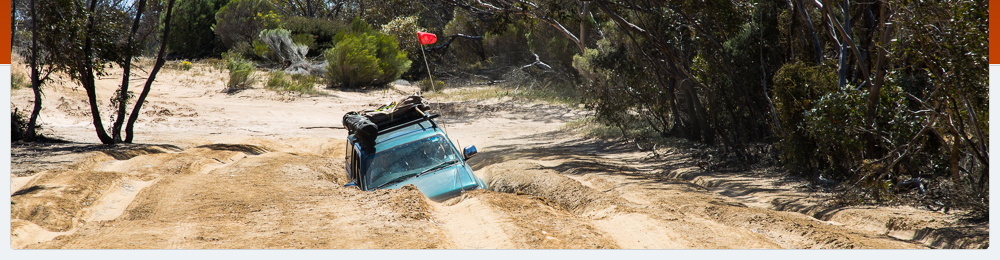 Hilux in a big rut